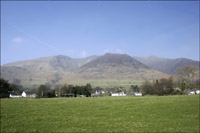 Hills dwarfing a row of houses